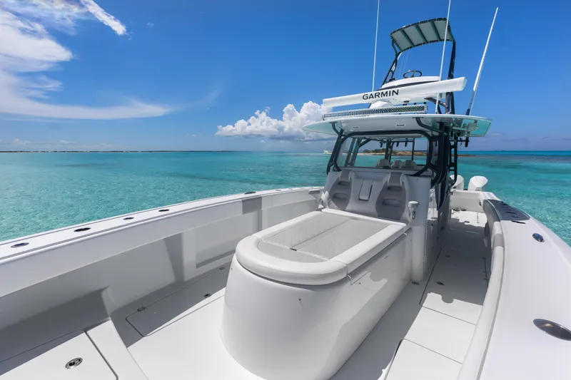 Reel Deal Yacht Photos Pics 2023 Freeman 42 LR boat on clear turquoise water under a bright blue sky.