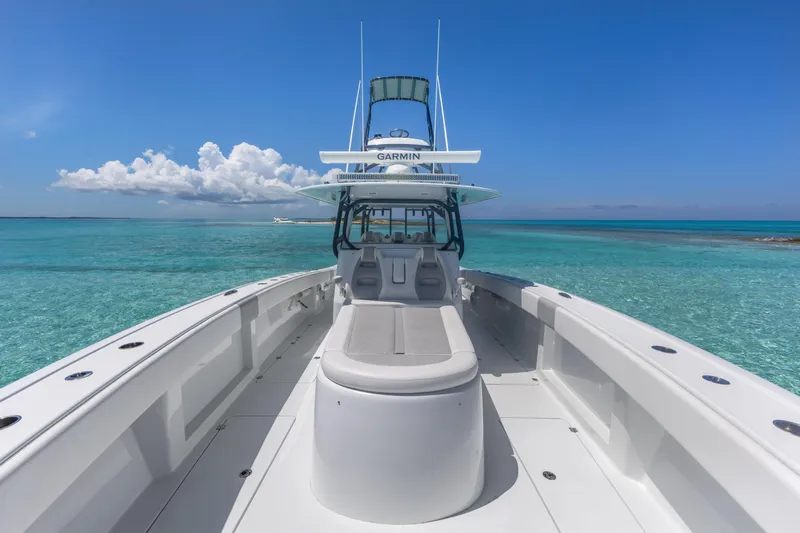 Reel Deal Yacht Photos Pics 2023 Freeman 42 LR boat on clear turquoise water under blue sky.