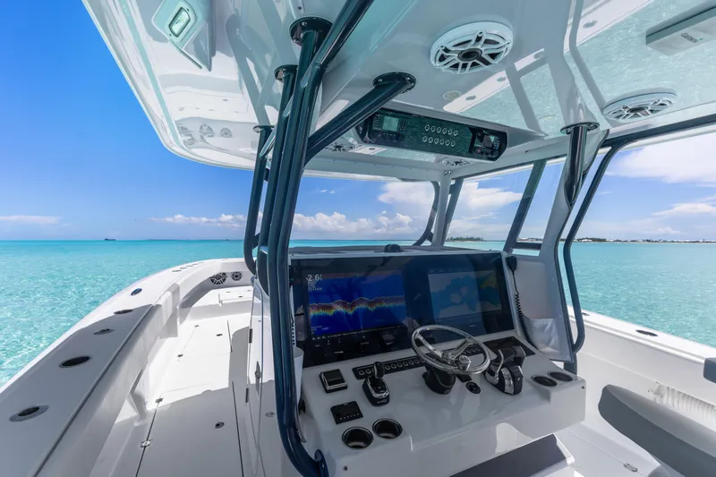 Reel Deal Yacht Photos Pics 2023 Freeman 42 LR boat interior with advanced navigation system on clear blue waters.