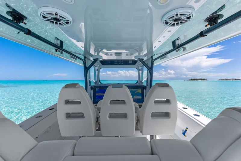 Reel Deal Yacht Photos Pics Interior view of 2023 Freeman 42 LR boat with ocean backdrop.