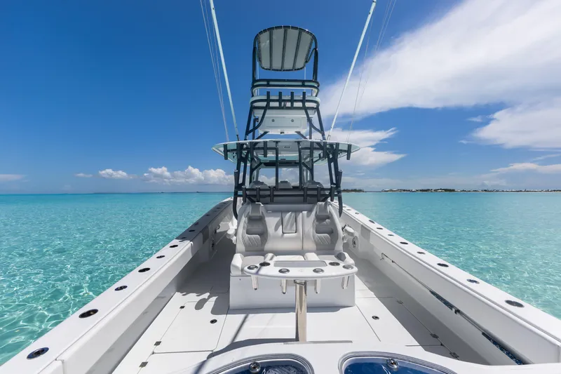 Reel Deal Yacht Photos Pics 2023 Freeman 42 LR boat on clear turquoise water under blue sky.