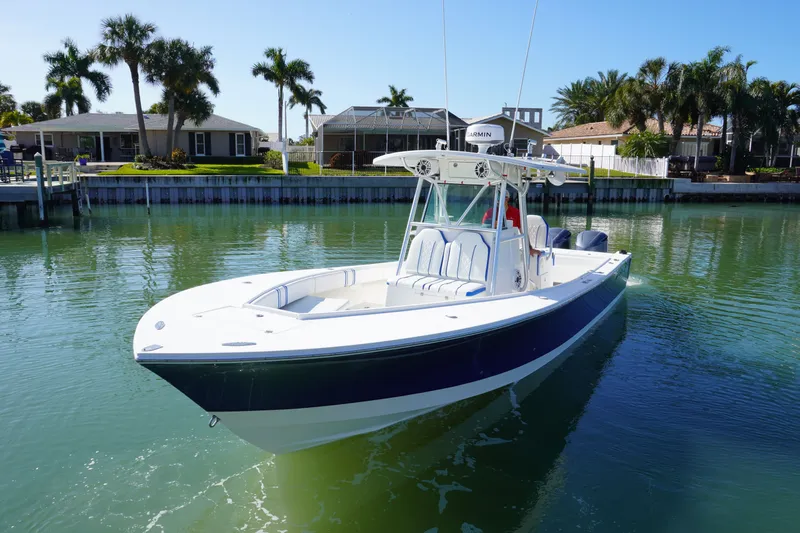 Knot Letting Go Yacht Photos Pics 2005 Regulator 32 boat anchored on calm water.
