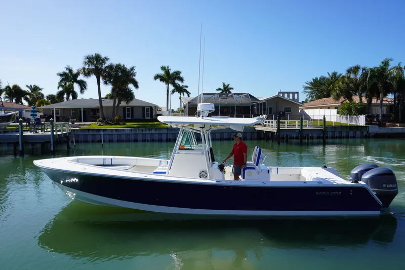 Knot Letting Go Yacht Photos Pics 2005 Regulator 32 Forward Seating boat on calm water.