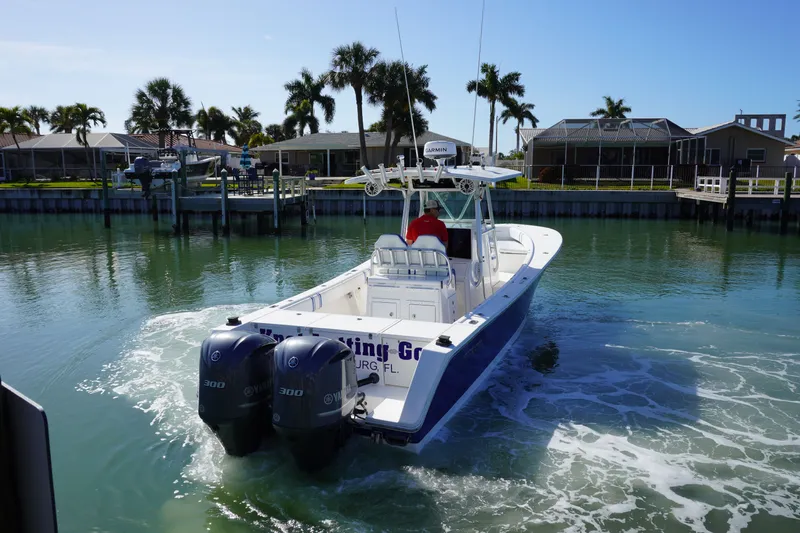 Knot Letting Go Yacht Photos Pics 2005 Regulator 32 boat cruising in sunny canal.