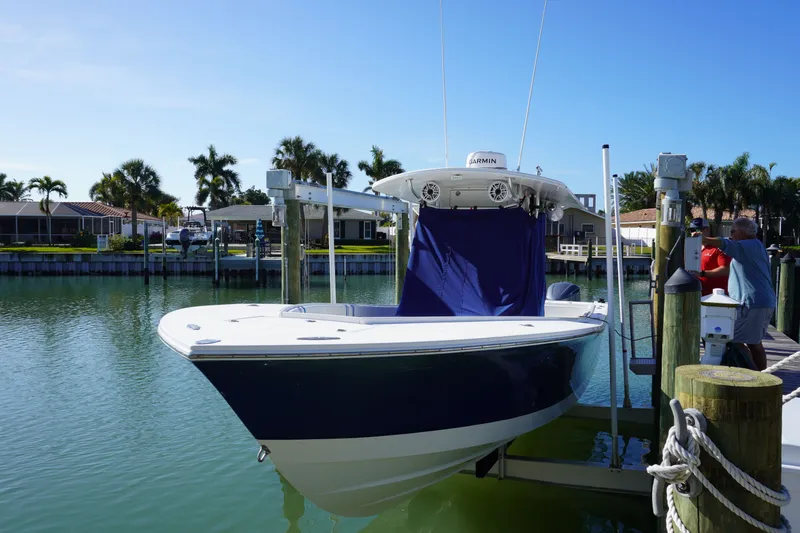 Knot Letting Go Yacht Photos Pics 2005 Regulator 32 boat docked with palm trees in background.
