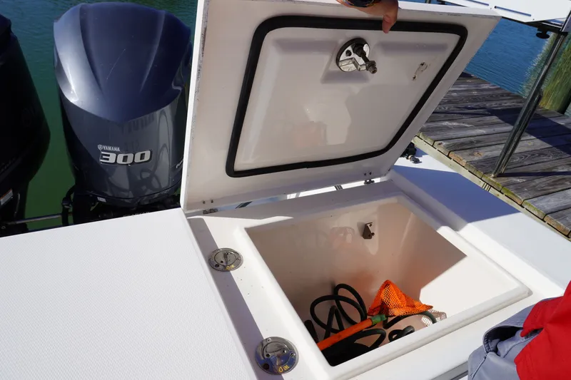 Knot Letting Go Yacht Photos Pics Regulator 32 boat with open storage compartment and Yamaha 300 engine.