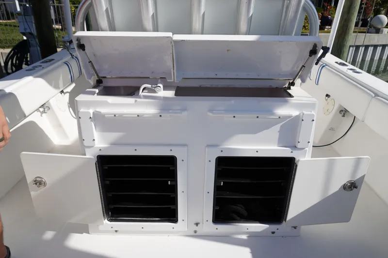 Knot Letting Go Yacht Photos Pics 2005 Regulator 32 boat with storage and seating area.