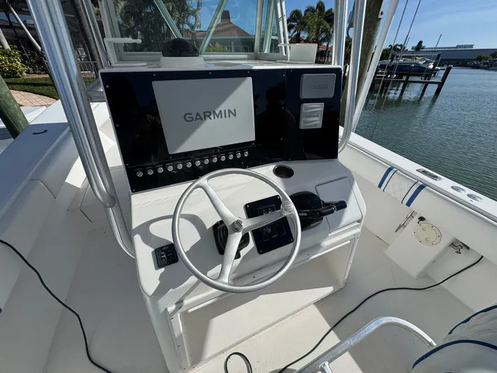 Knot Letting Go Yacht Photos Pics 2005 Regulator 32 boat helm with Garmin navigation system.