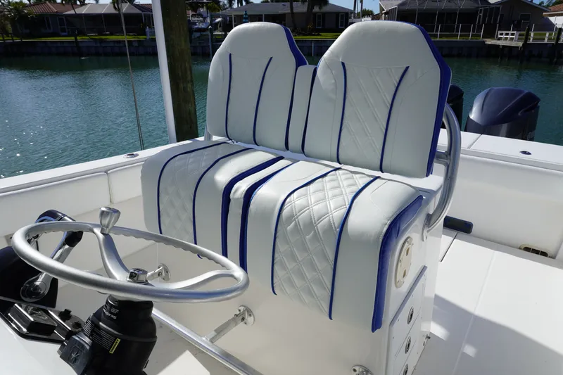 Knot Letting Go Yacht Photos Pics Regulator 32 boat seating with blue accents, year 2005.