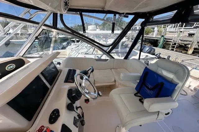  Yacht Photos Pics 2008 Grady-White Express 330 boat interior with helm, seating, and marina view.