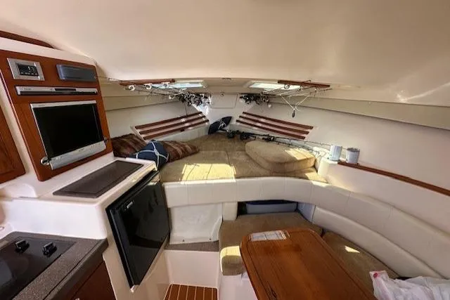  Yacht Photos Pics Interior of 2008 Grady-White Express 330 boat with seating, kitchenette, and storage.