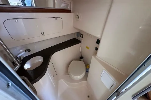  Yacht Photos Pics 2008 Grady-White Express 330 boat bathroom with sink, toilet, and storage.