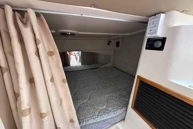  Yacht Photos Pics 2008 Grady-White Express 330 cabin interior with bed and curtain.