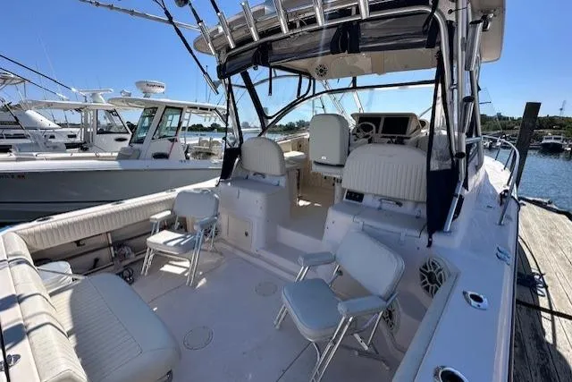  Yacht Photos Pics 2008 Grady-White Express 330 boat interior with seating and helm, docked at marina.