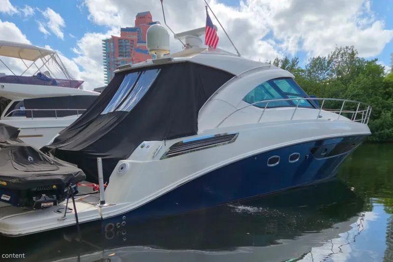 Moonwake Yacht Photos Pics 2014 Sea Ray 470 Sundancer yacht docked, featuring sleek design and modern amenities.