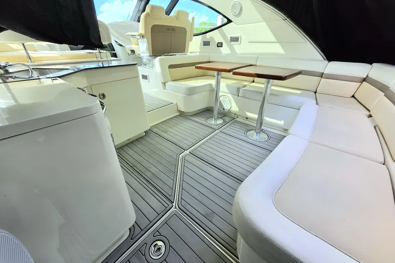 Moonwake Yacht Photos Pics Luxurious interior of 2014 Sea Ray 470 Sundancer yacht with elegant seating and tables.