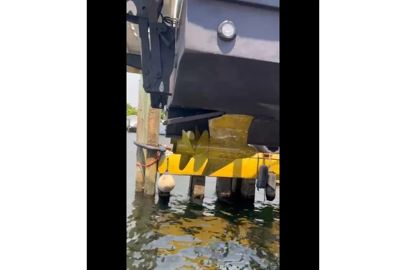 Moonwake Yacht Photos Pics 2014 Sea Ray 470 Sundancer boat docked, showing hull and water reflection.