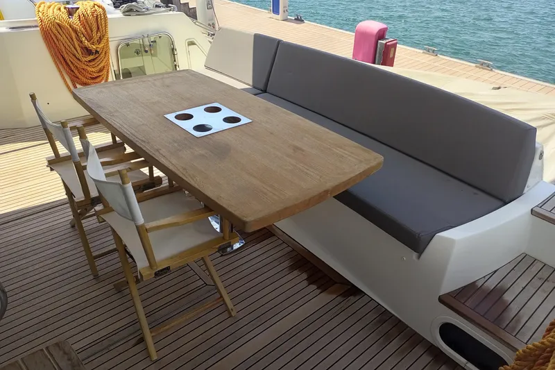 Lt Yacht Photos Pics Luxury yacht deck with wooden table and seating, 2016 Prestige 550 model.