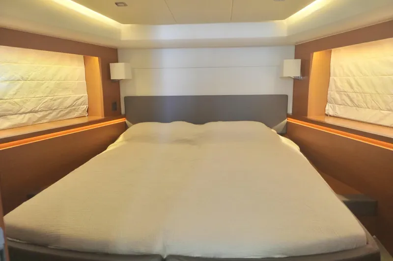 Lt Yacht Photos Pics Luxurious bedroom interior of 2016 Prestige 550 yacht with modern lighting and cozy bedding.