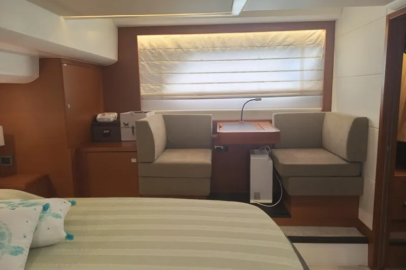 Lt Yacht Photos Pics Luxurious interior of a 2016 Prestige 550 yacht with cozy seating and modern decor.