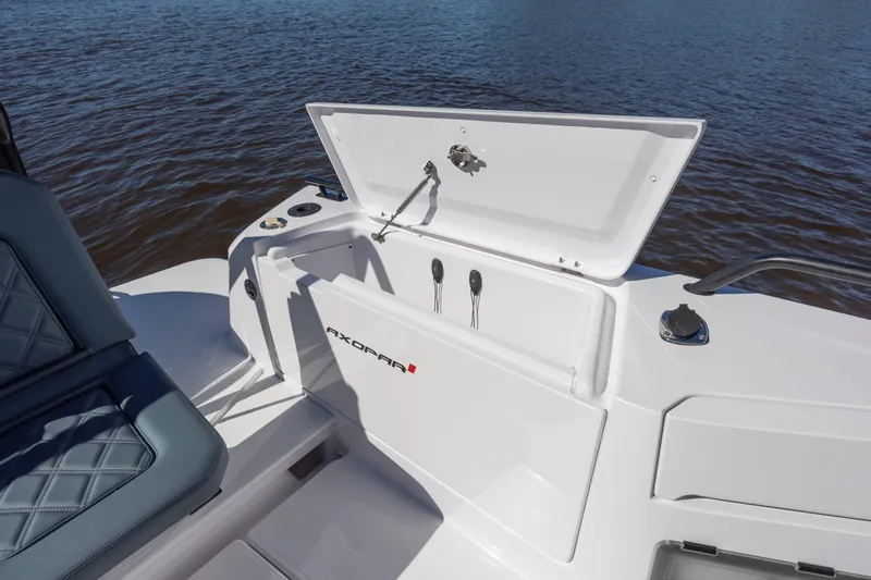  Yacht Photos Pics 2022 Axopar 37 Sun Top boat with open storage compartment on deck.