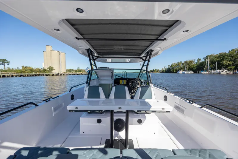  Yacht Photos Pics 2022 Axopar 37 Sun Top boat interior on a calm river.