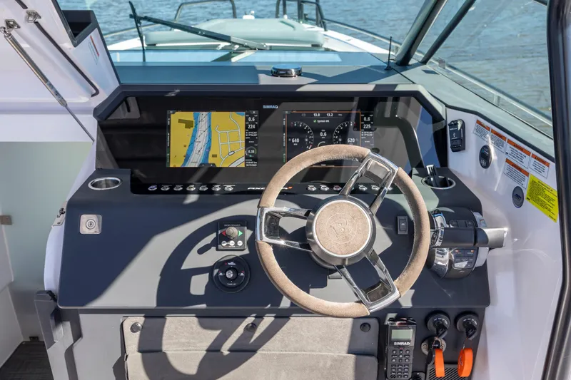  Yacht Photos Pics 2022 Axopar 37 Sun Top helm with navigation display and controls.