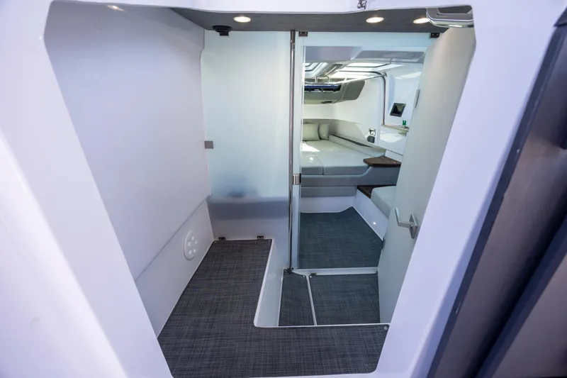  Yacht Photos Pics Interior cabin of 2022 Axopar 37 Sun Top, featuring modern design and comfortable seating.