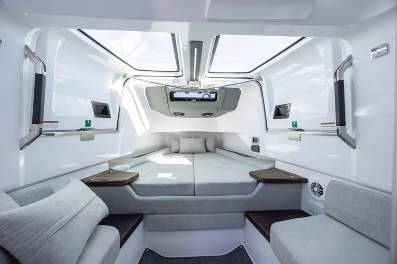 Yacht Photos Pics Luxurious interior of 2022 Axopar 37 Sun Top boat with modern seating and skylights.