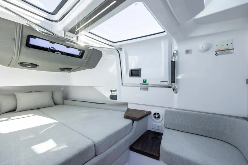  Yacht Photos Pics Interior of 2022 Axopar 37 Sun Top, featuring modern seating and skylight.