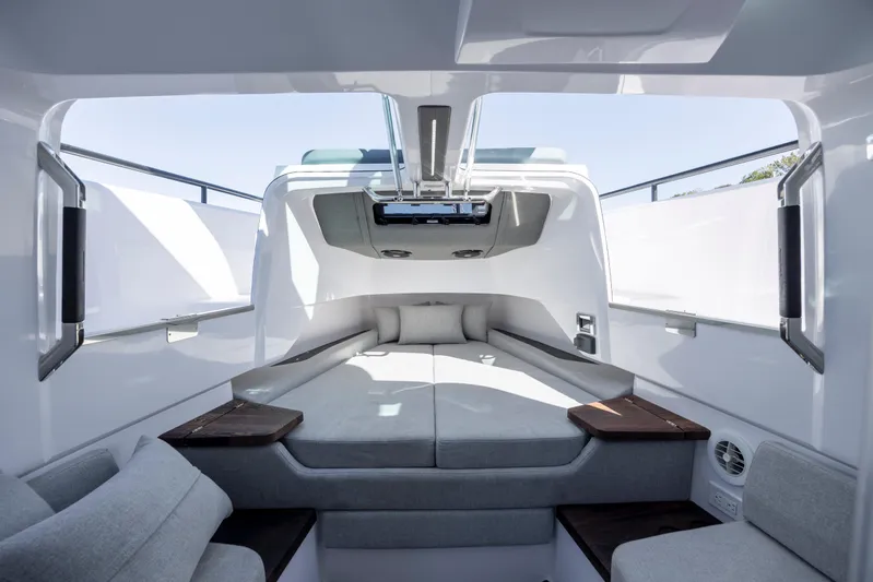  Yacht Photos Pics 2022 Axopar 37 Sun Top cabin interior with modern seating and sleek design.