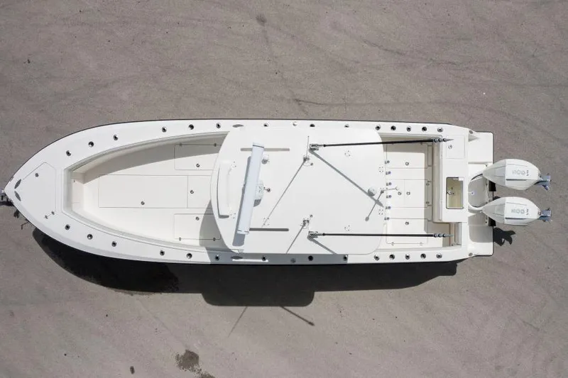  Yacht Photos Pics Overhead view of 2025 SeaVee 320B boat with dual engines on a concrete surface.