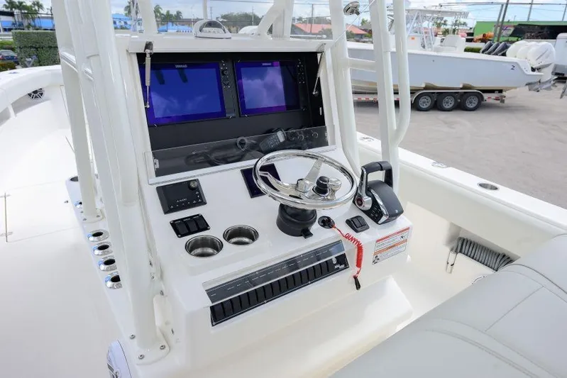  Yacht Photos Pics 2025 SeaVee 320B boat console with dual screens and steering wheel.