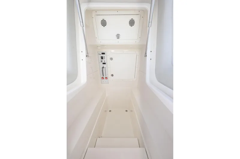  Yacht Photos Pics Interior view of 2025 SeaVee 320B boat, featuring control panel and storage compartments.