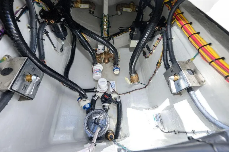  Yacht Photos Pics Interior view of 2025 SeaVee 320B boat's engine compartment with wiring and components.