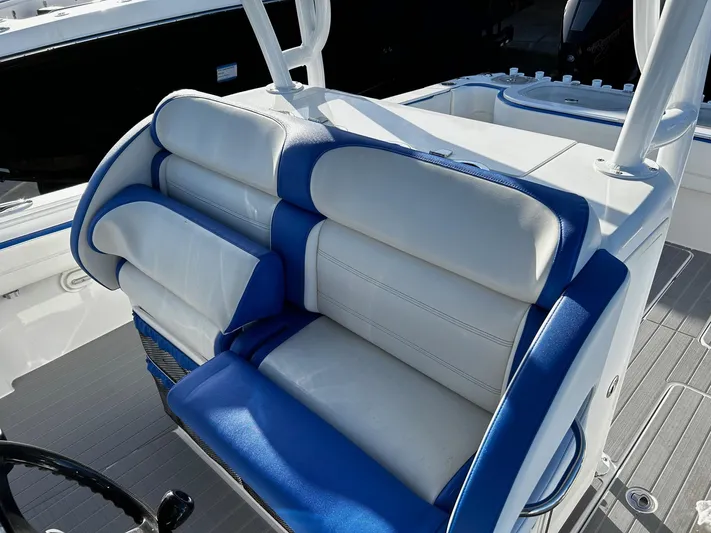  Yacht Photos Pics 2022 Nor-Tech 392 Superfish boat with blue and white cushioned seating.