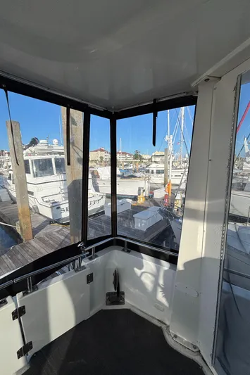 Busy Living Yacht Photos Pics 2001 Carver 396 Aft Cabin MY interior view with marina backdrop.