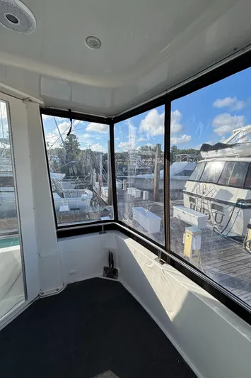 Busy Living Yacht Photos Pics 2001 Carver 396 Aft Cabin MY interior with marina view through large windows.