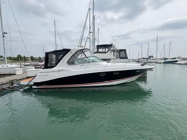  Yacht Photos Pics 2007 Four Winns 378 Vista yacht docked in a marina with sailboats.
