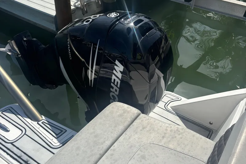 Namaste Yacht Photos Pics Aquila 36 Sport 2018 boat with Mercury Verado outboard engine in water.