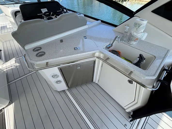 Namaste Yacht Photos Pics Aquila 36 Sport 2018 yacht interior with sleek kitchenette and modern design.