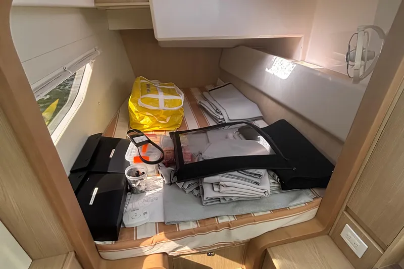 Namaste Yacht Photos Pics Interior cabin of 2018 Aquila 36 Sport with storage and supplies.