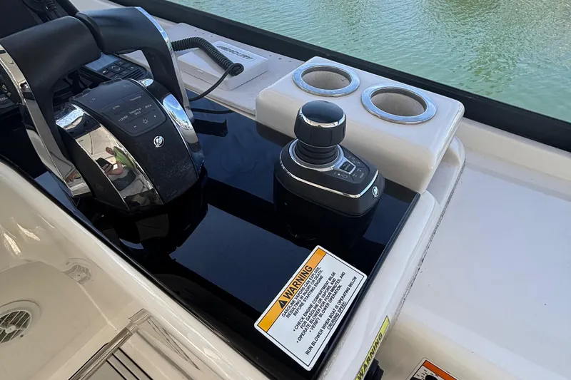 Namaste Yacht Photos Pics Control panel of 2018 Aquila 36 Sport boat with throttle and joystick.