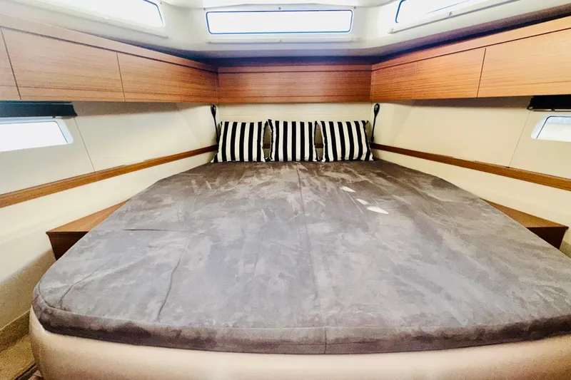 Least Expensive 39 Hybrid In The Country Yacht Photos Pics Luxurious cabin interior of 2021 Greenline 39 Hybrid yacht with striped pillows.