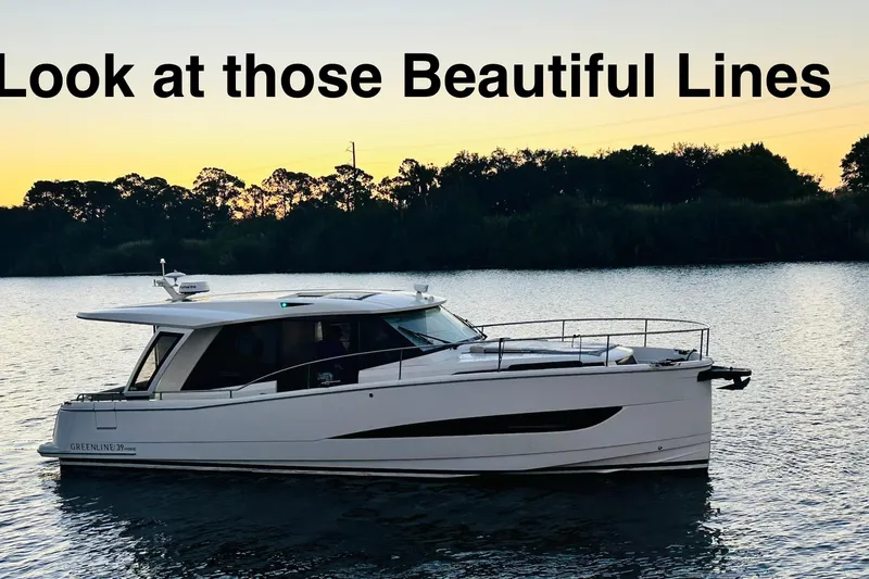 Least Expensive 39 Hybrid In The Country Yacht Photos Pics 2021 Greenline 39 Hybrid yacht on serene water at sunset, showcasing sleek design.