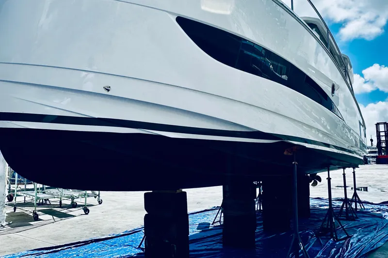 Least Expensive 39 Hybrid In The Country Yacht Photos Pics 2021 Greenline 39 Hybrid yacht on stands, showcasing sleek design under a blue sky.