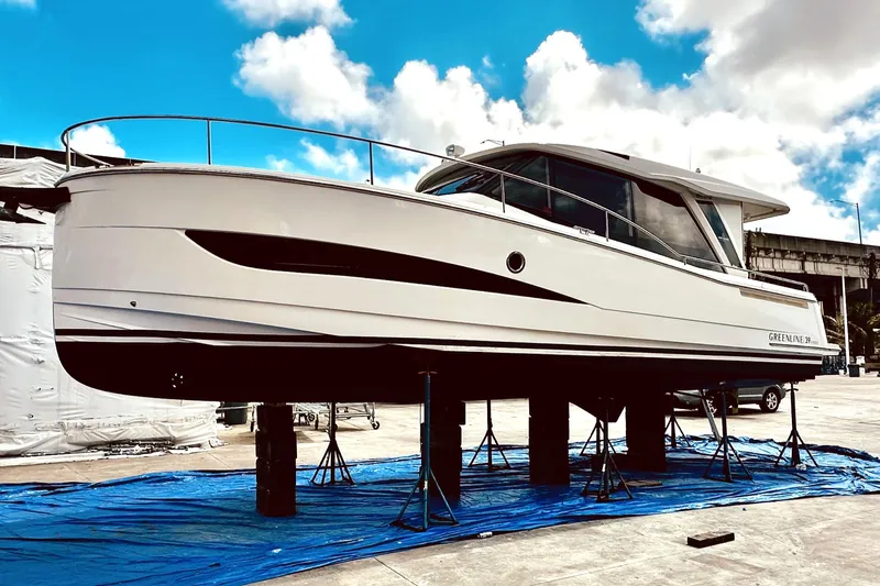 Least Expensive 39 Hybrid In The Country Yacht Photos Pics 2021 Greenline 39 Hybrid yacht on stands, showcasing sleek design under a blue sky.