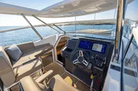 2023 Nimbus W11 yacht cockpit with modern navigation system and luxurious seating.