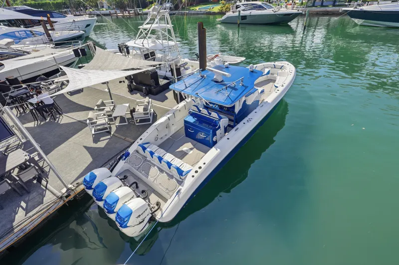  Yacht Photos Pics 2019 Midnight Express 43 Open boat docked at marina with blue accents and multiple engines.