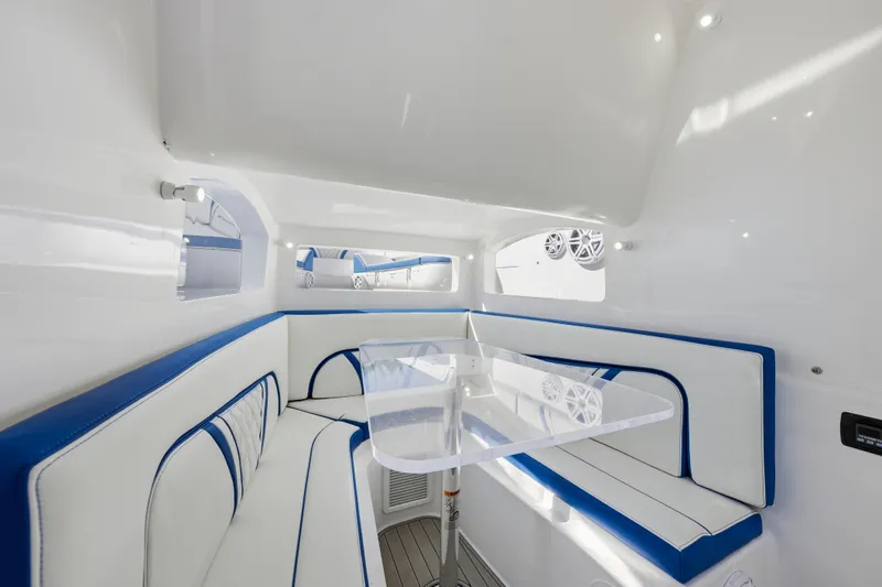  Yacht Photos Pics Luxurious interior of 2019 Midnight Express 43 Open boat with white and blue seating.